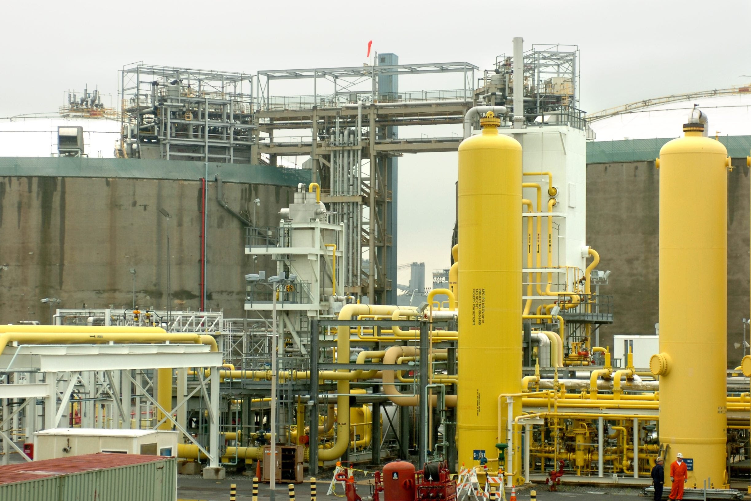 The Philadelphia Gas Works plant in Port Richmond has produced liquefied natural gas since 1973 and stores it in two tall insulated tanks s in the background. The LNG is turned back into gas in the winter for use on peak heating days. A proposed LNG export facility would be much larger.
