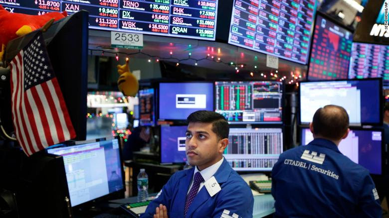 Stocks stabilize after Christmas Eve drop