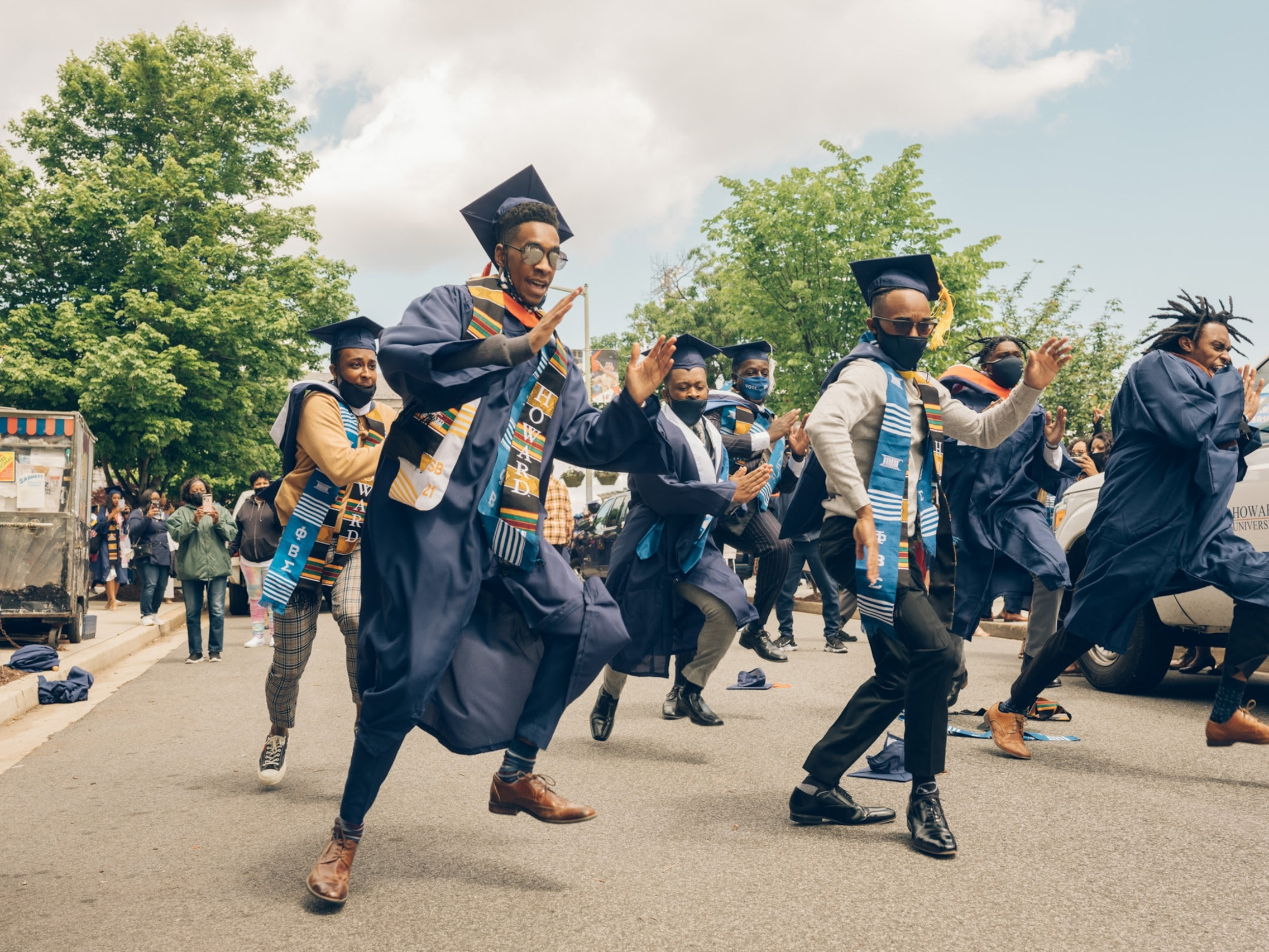 recent graduates from Howard University dance in the streets in Washington DC