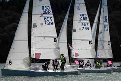 J/70s sailing team racing off Royal Yacht Squadron