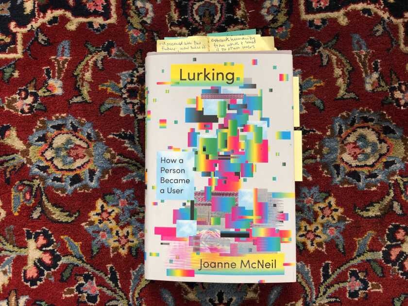 A copy of the book "Lurking" on a floral carpet
