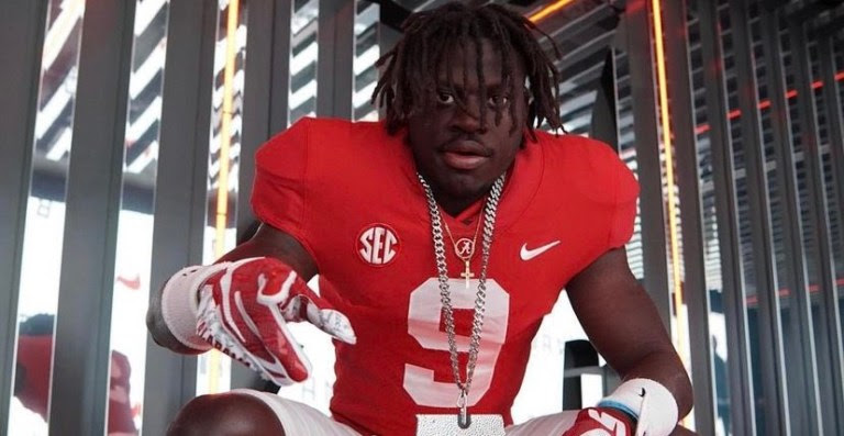 Richard Young poses in Alabama uniform and bama chain