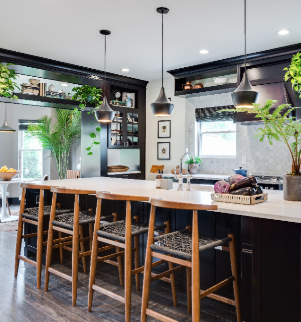 A natural color palette mixed with plants make this room feel open and classic.