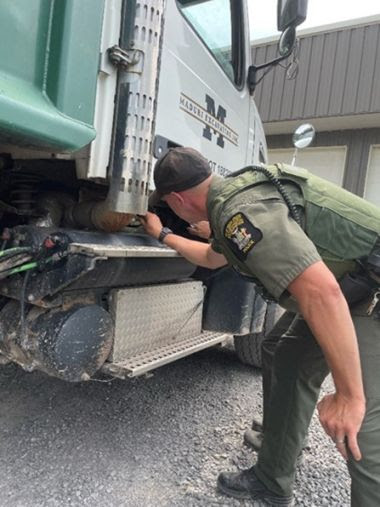 ECO checks exhaust of large tractor trailer