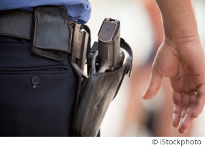 Close up of a police handgun in the holster.