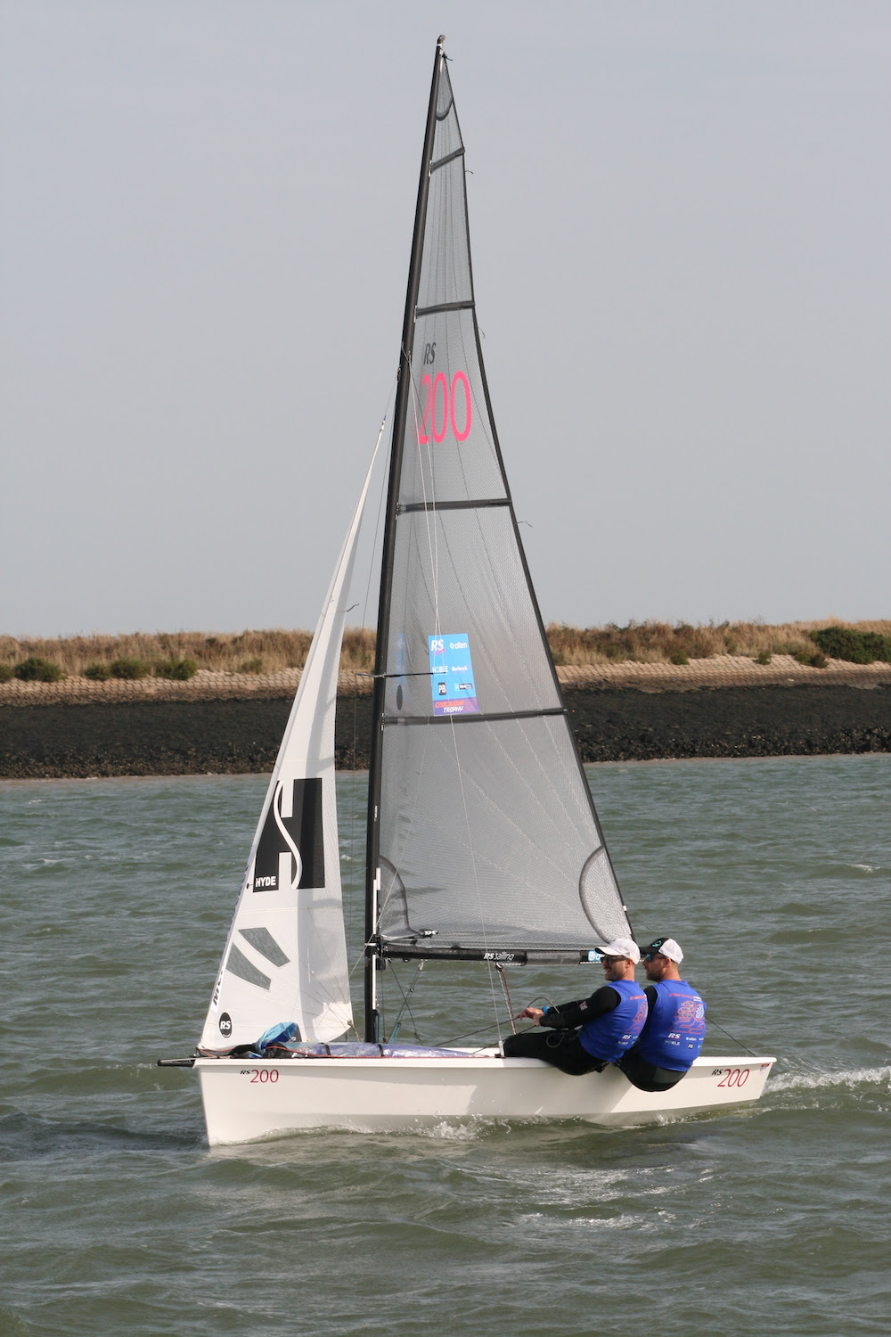 Christian Birrell and Luke Patience (Merlin Rocket) take a comfortable lead in race three – photo Sue Pelling 4 Benjamin Pascoe (7) in action downwind with his dad Sam (505) – photo Roger Mant