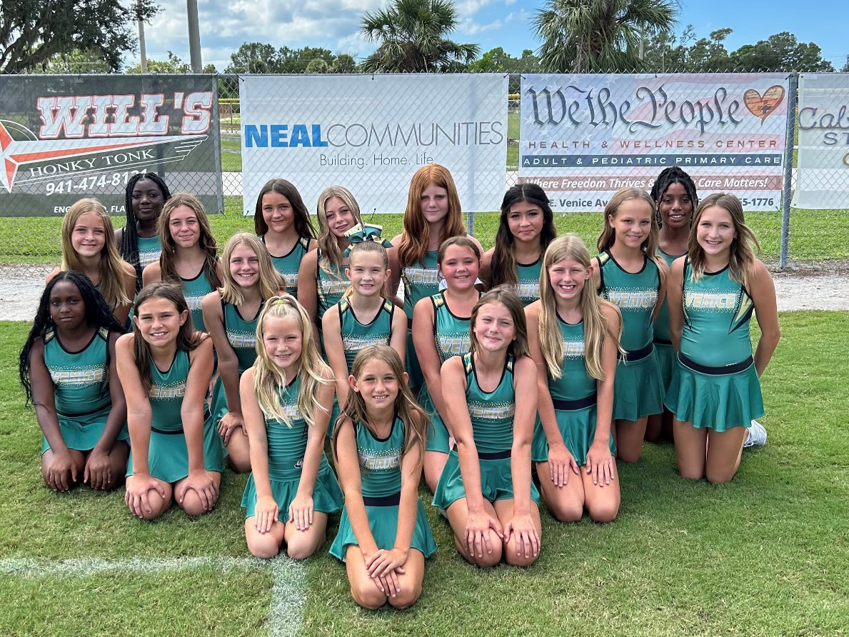 A group of girls posing for a photo
Description automatically generated