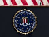 In this June 14, 2018, file photo, the FBI seal is seen before a news conference at FBI headquarters in Washington. (AP Photo/Jose Luis Magana, File)