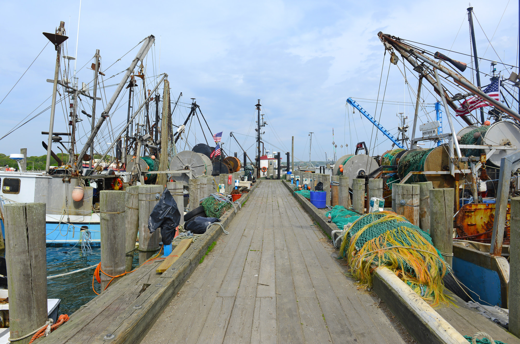 commercial fishing gear and vessels at a commercial fishing dock
