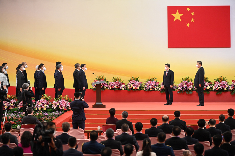 Chinese President Xi Jinping in front of a Chinese flag at a ceremony in Hong Kong.