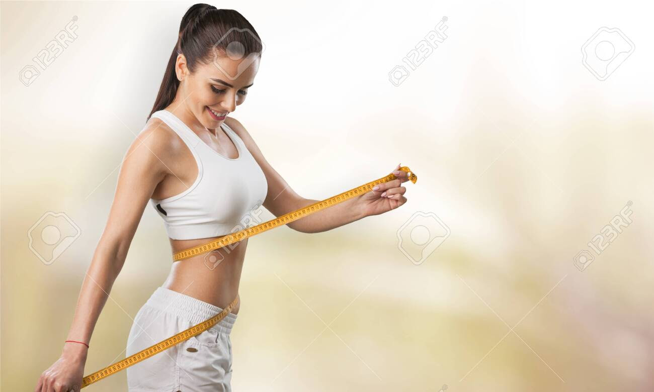 Weight Loss, Slim Body, Healthy Lifestyle Concept. Fit Fitness Girl  Measuring Her Waistline With Measure Tape On Blue Stock Photo, Picture and  Royalty Free Image. Image 124542865.