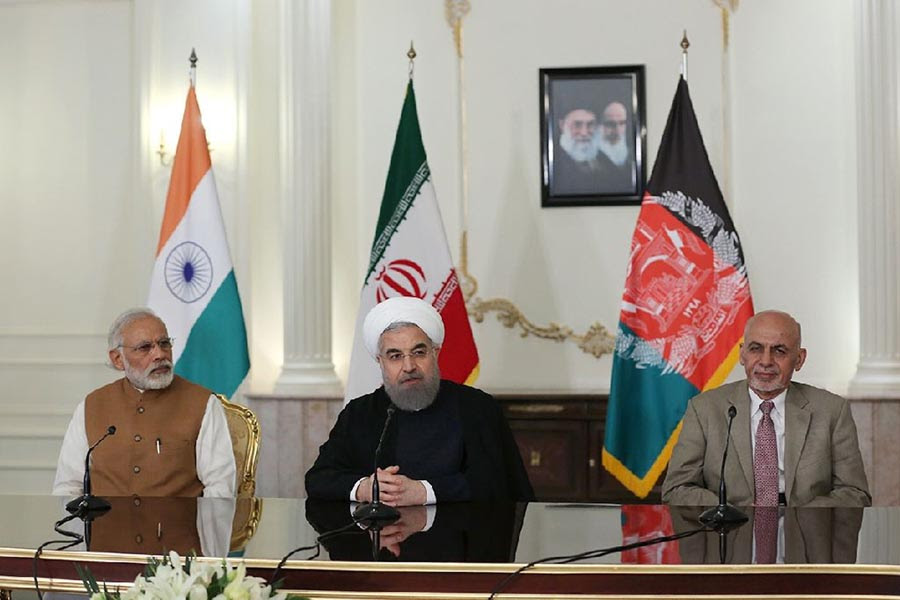 Iranian President Hassan Rouhani (centre) speaks at a joint press briefing with Indian Prime Minister Narendra Modi (left) and Afghan President Ashraf Ghani in Tehran on 23 May 2016.