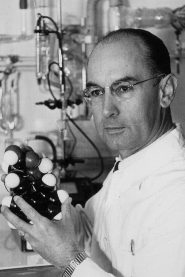 Albert Hofmann, the “father” of LSD, holding a model of the molecule.