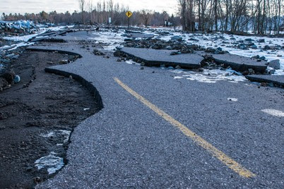 Cracked pavement is shown along Lakeshore Boulevard in Marquette, caused by high-water storms off Lake Superior.