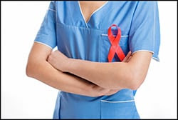 The figure above is a photograph showing a medical professional wearing a red HIV awareness ribbon.