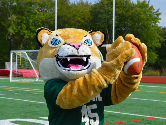 Austin Prep cougar mascot with a football