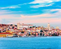 Lisbon's cityscape with its colorful buildings and the Tagus River in the background