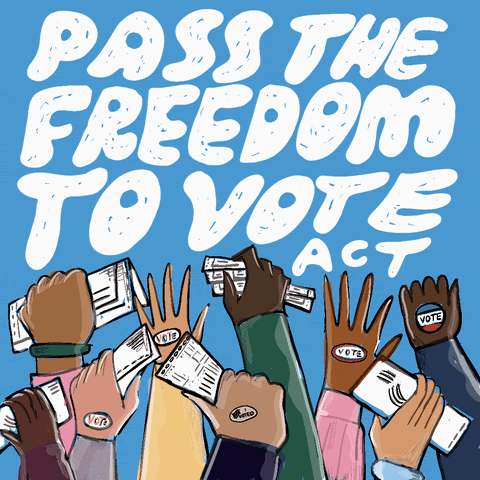 Image of people's hands raised in the air holding ballots with the words "pass the freedom to vote act" written
