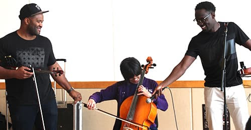 Black Violin working with a student.