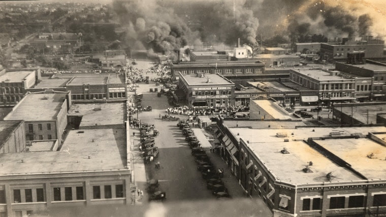 Crowds of people watching the fires on June 1, 1921 in Tulsa, Okla., looking from Cincinnati Ave. from 2nd St. to Detroit Ave.