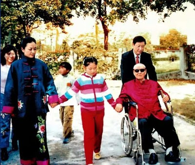 File photo of Xi Jinping (R, rear) with his father Xi Zhongxun (R, front), his wife Peng Liyuan (L, front) and his daughter (C, front).