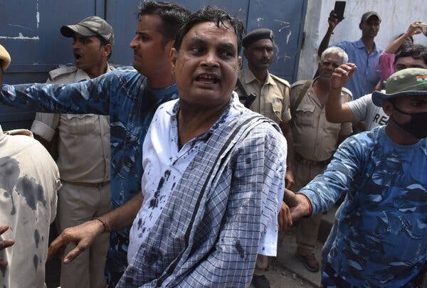 Police officers escorting Brajesh Thakur, the director of the Muzaffarpur shelter, to court in 2018.