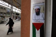 Photo of Al Qaeda founder and former leader, Osama Bin Laden, seen above a Palestinian Authority flag.