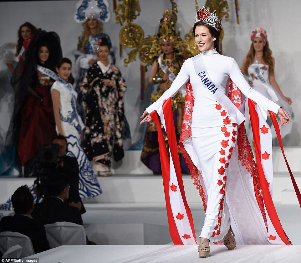 Miss Canada Kathryn Kohut represented the Canadian flag in her figure-hugging white and red dress and flowing cape embroidered with the iconic maple leaf. She glammed up the look with a red and silver crown.