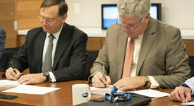 Dr. Kadlec and  DARPA signing agreement