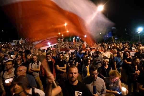 People participate in a protest in front of the Senate building in Warsaw, July 20. (Bartlomiej Zborowski/European Pressphoto Agency)