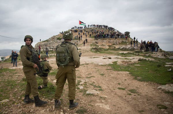 Israeli soldiers standing guard in March at a protest against Israeli settlements in the West Bank.