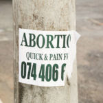 1280px-Abortion_Quick_&_Pain_Free_sign,_Joe_Slovo_Park,_Cape_Town,_South_Africa-3869