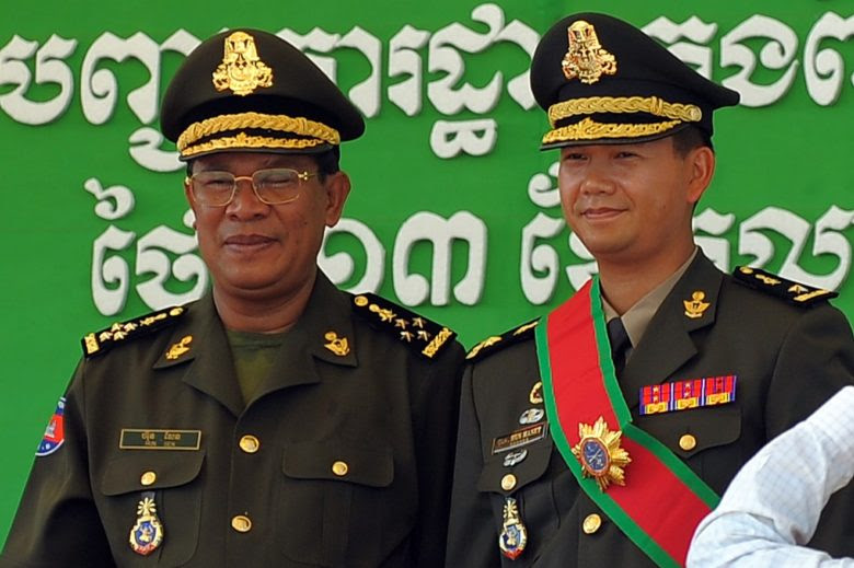 Cambodian Prime Minister Hun Sen (L) with his West Point-trained son Hun Manet, who many think is being groomed to take over from his father some time after the July 29 elections. Photo: AFP/Tang Chhin Sothy