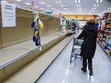 Customers found the shelves empty of toilet paper at a grocery store in Spokane, Washington, last week. More than 6,000 complaints of coronavirus-related price gouging were filed last week with state attorneys-general offices across the country. (The Spokesman-Review via Associated Press)