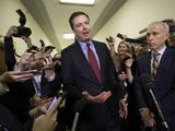 In this Dec. 7, 2018, file photo, Former FBI Director James Comey, with his attorney, David Kelley, right, speaks to reporters after a day of testimony before the House Judiciary and Oversight committees, on Capitol Hill in Washington. (AP Photo/J. Scott Applewhite, File)