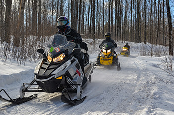 Snowmobilers are shown enjoying a trail ride in Gogebic County.