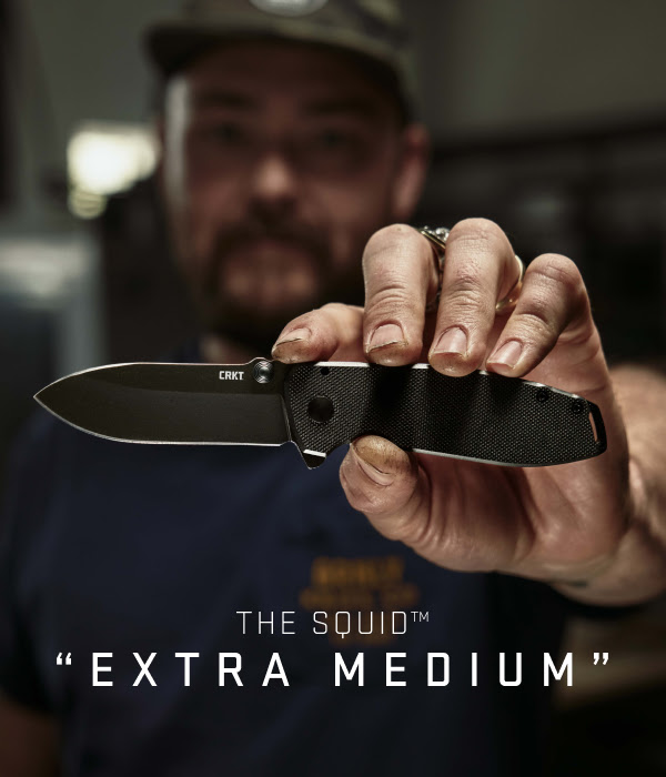 Knifemaker Lucas Burnley holding the Squid XM in front of him. A caption on the bottom of the image reads 'The Squid™ "Extra Medium"'