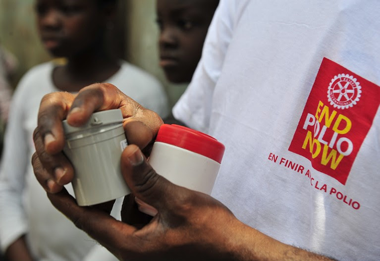 UA man holds boxes of polio vaccine during the opening of the second national day of polio vaccinations.