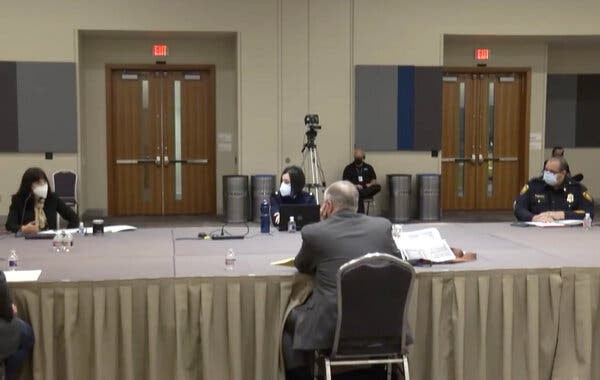 Mr. DeLord, center, at a
negotiation session in February between the City of San
Antonio and the police union.