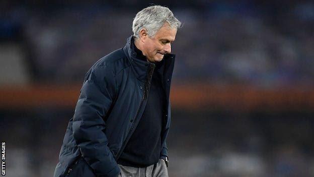 Jose Mourinho walks with his hands in his pocket, looking at the ground