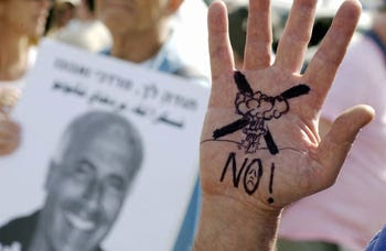 Supporters of Mordechai Vanunu gather on the day of his release from prison, Shikma Prison, Ashkelon, April 21, 2004. 
