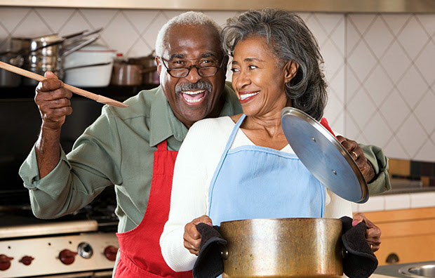 A senior couple cooking together.