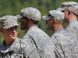 In this Aug. 21, 2015 file photo, U.S. Army Capt. Kristen Griest, left, of Orange, Conn., stands in formation during an Army Ranger School graduation ceremony at Fort Benning, Ga. In arguments to be heard on a college campus, federal appeals court judges on Tuesday, March 3, 2020, will consider whether the military&#39;s all-male draft system is constitutional. A Texas-based federal judge ruled last year that it is not, ruling in a lawsuit brought by the National Coalition for Men. The government appealed, leading to Tuesday&#39;s hearing before a three judge panel of the 5th U.S. Circuit Court of Appeals. (AP Photo/John Bazemore, File) **FILE*