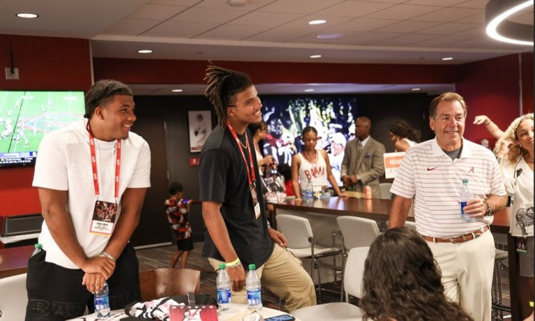 Jacob and jerod smith with nick saban during alabama visit