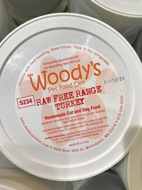 Woody's Raw Free Range Turkey Pet Food container lable sell by 01/12/20