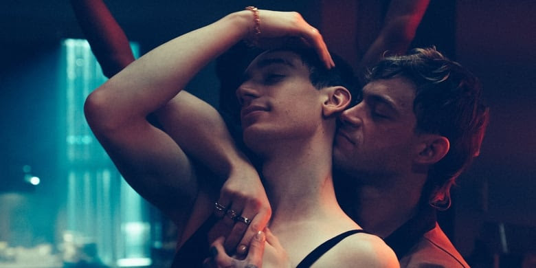 Still Frame From The Film Solo. Félix Maritaud Tenderly Leans In To Théodore Pellerin As They Dance Together.