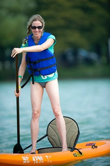 girl stand-up paddling