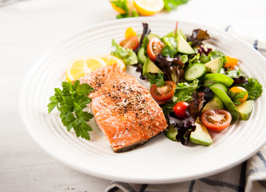 grilled salmon and salad on a plate