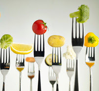 Fruits and vegetables on forks