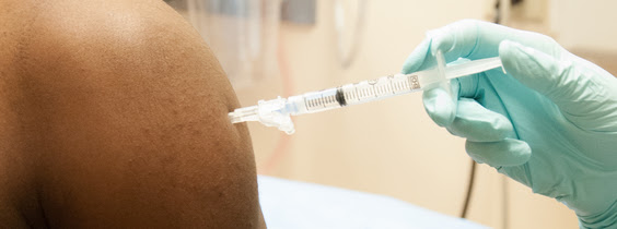 Volunteer receives a vaccine
